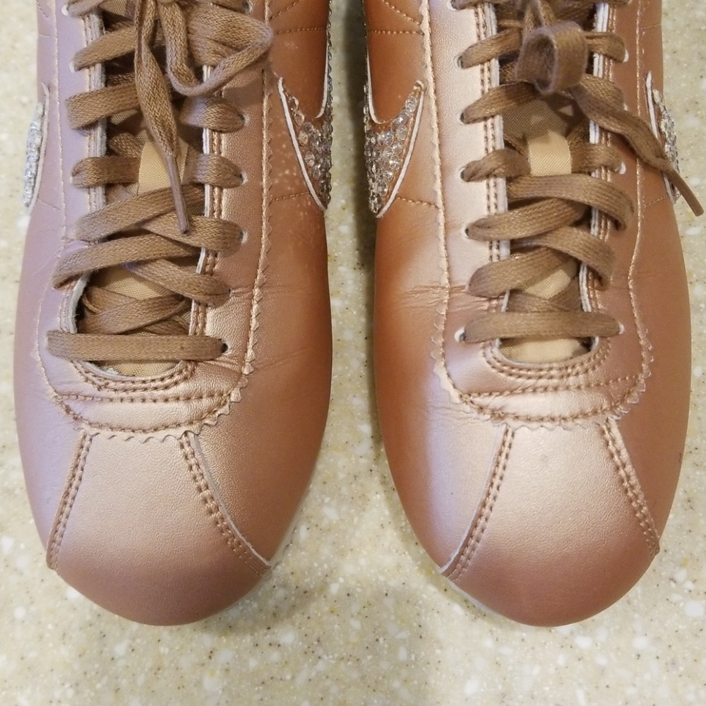Classic Nike tennis shoes in Rose Gold